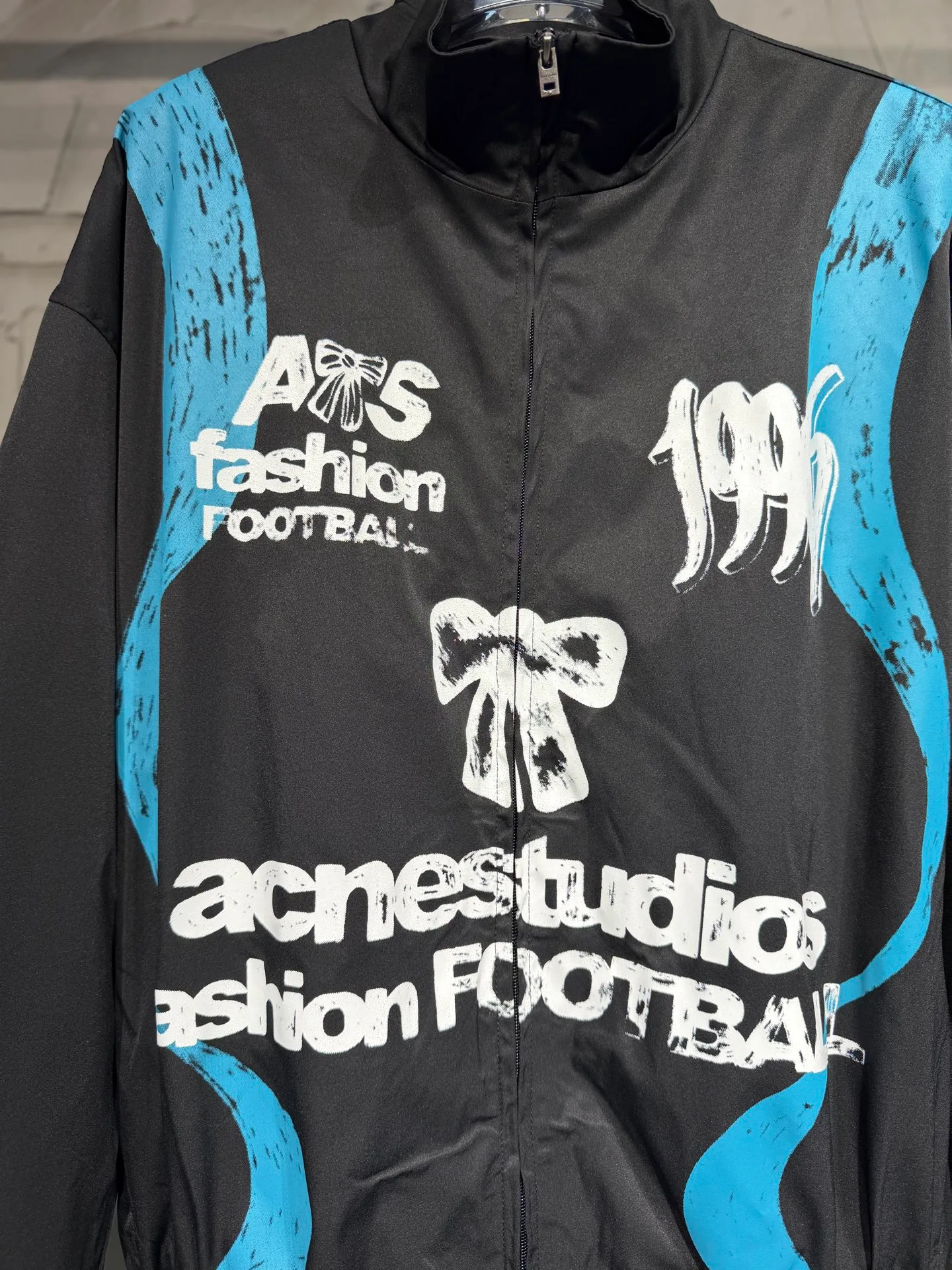 Acne studios World Cup Fashion Football Series Capsule Jacket Printed Jacket A capsule Series full of fun. Doodles, sketches and handwriting are all transformed into intentional designs. Imperfect lines and intuitive brushstrokes create a sense of reality, like a signed jersey or a message in the locker room. Each item carries a story, a memory, and a signature. Size: SML Color: Black, White